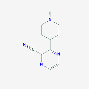 molecular formula C10H12N4 B1473164 3-(Piperidin-4-yl)pyrazine-2-carbonitrile CAS No. 1934968-08-7