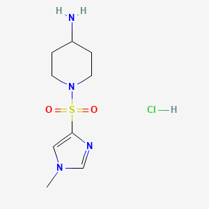 molecular formula C9H17ClN4O2S B1473385 1-[(1-methyl-1H-imidazol-4-yl)sulfonyl]piperidin-4-amine hydrochloride CAS No. 2098130-17-5
