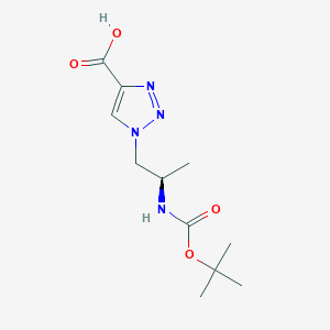 molecular formula C11H18N4O4 B1474243 1-{(2R)-2-[(tert-Butoxycarbonyl)amino]propyl}-1H-1,2,3-triazole-4-carboxylic acid CAS No. 1353548-46-5