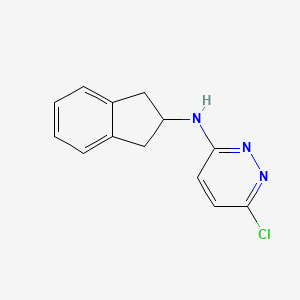 molecular formula C13H12ClN3 B1474629 6-chloro-N-(2,3-dihydro-1H-inden-2-yl)pyridazin-3-amine CAS No. 1921250-77-2