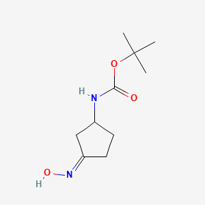 molecular formula C10H18N2O3 B1474941 (3-Hydroxyiminocyclopentyl)-carbamic acid tert-butyl ester CAS No. 1663510-73-3