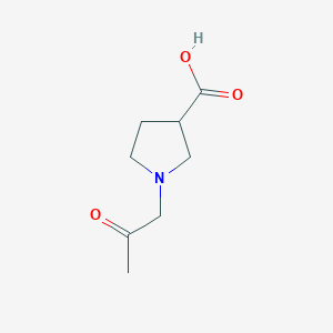 molecular formula C8H13NO3 B1475836 1-(2-Oxopropyl)pyrrolidine-3-carboxylic acid CAS No. 2090945-42-7