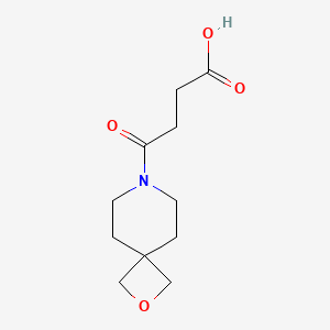 molecular formula C11H17NO4 B1477203 4-Oxo-4-(2-oxa-7-azaspiro[3.5]nonan-7-yl)butanoic acid CAS No. 2092530-06-6