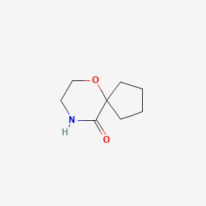 molecular formula C8H13NO2 B1478090 6-Oxa-9-azaspiro[4.5]decan-10-one CAS No. 1934762-62-5