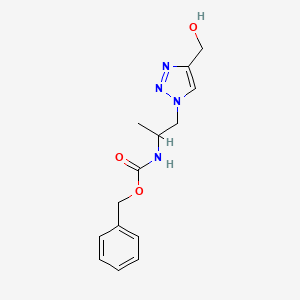molecular formula C14H18N4O3 B1480659 苄基(1-(4-(羟甲基)-1H-1,2,3-三唑-1-基)丙烷-2-基)氨基甲酸酯 CAS No. 2098133-91-4