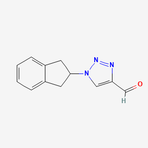 1-(2,3-dihydro-1H-inden-2-yl)-1H-1,2,3-triazole-4-carbaldehyde