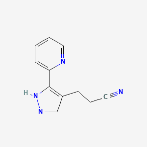 molecular formula C11H10N4 B1482296 3-(3-(pyridin-2-yl)-1H-pyrazol-4-yl)propanenitrile CAS No. 2098141-21-8