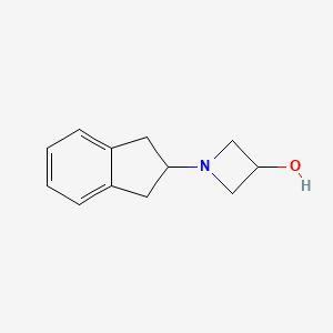 molecular formula C12H15NO B1482328 1-(2,3-dihydro-1H-inden-2-yl)azetidin-3-ol CAS No. 2098026-02-7