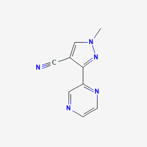 molecular formula C9H7N5 B1482545 1-methyl-3-(pyrazin-2-yl)-1H-pyrazole-4-carbonitrile CAS No. 2098143-68-9