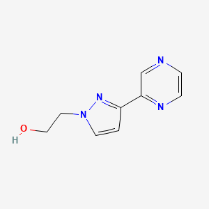 molecular formula C9H10N4O B1483676 2-(3-(pyrazin-2-yl)-1H-pyrazol-1-yl)ethan-1-ol CAS No. 2092528-43-1