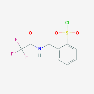 molecular formula C9H7ClF3NO3S B1484414 2-{[(2,2,2-Trifluoroacetyl)amino]methyl}benzenesulfonyl chloride CAS No. 2168200-85-7