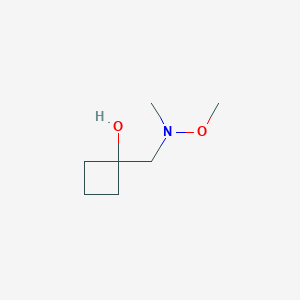 molecular formula C7H15NO2 B1485666 1-{[Methoxy(methyl)amino]methyl}cyclobutan-1-ol CAS No. 2197544-14-0