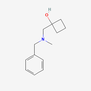 molecular formula C13H19NO B1485775 1-{[Benzyl(methyl)amino]methyl}cyclobutan-1-ol CAS No. 2198468-61-8