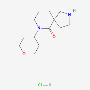 molecular formula C13H23ClN2O2 B1486006 7-Tetrahydro-2H-pyran-4-yl-2,7-diazaspiro[4.5]decan-6-one hydrochloride CAS No. 2206970-17-2