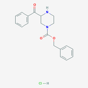 molecular formula C19H21ClN2O3 B1486053 Benzyl 3-benzoyl-1-piperazinecarboxylate hydrochloride CAS No. 2206969-91-5