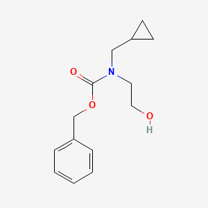 molecular formula C14H19NO3 B1487146 Cyclopropylmethyl-(2-hydroxyethyl)-carbamic acid benzyl ester CAS No. 2142656-96-8