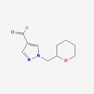 molecular formula C10H14N2O2 B1488919 1-[(oxan-2-yl)methyl]-1H-pyrazole-4-carbaldehyde CAS No. 1341903-71-6
