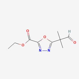 molecular formula C9H12N2O4 B14897526 Ethyl 5-(2-methyl-1-oxopropan-2-yl)-1,3,4-oxadiazole-2-carboxylate 