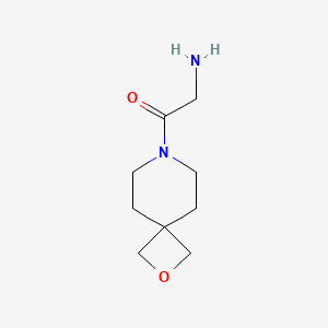 molecular formula C9H16N2O2 B1490394 2-氨基-1-{2-氧杂-7-氮杂螺[3.5]壬烷-7-基}乙酮 CAS No. 1824269-87-5