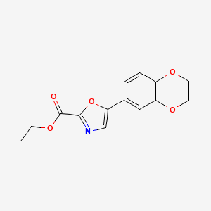 molecular formula C14H13NO5 B1493278 Ethyl 5-(2,3-dihydrobenzo[b][1,4]dioxin-6-yl)oxazole-2-carboxylate CAS No. 2098016-11-4