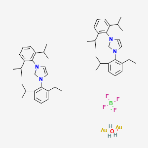 molecular formula C54H79Au2BF4N4O B1495463 Oxidanium;1,3-bis[2,6-di(propan-2-yl)phenyl]-2H-imidazole;gold;tetrafluoroborate 