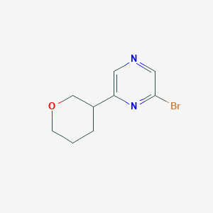 molecular formula C9H11BrN2O B15045182 2-Bromo-6-(oxan-3-yl)pyrazine 