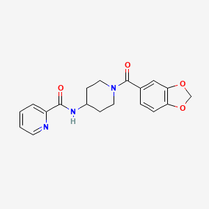 molecular formula C19H19N3O4 B15104322 N-[1-(1,3-benzodioxol-5-ylcarbonyl)piperidin-4-yl]pyridine-2-carboxamide 