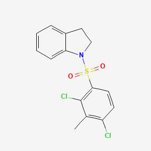 molecular formula C15H13Cl2NO2S B15105340 2,4-Dichloro-1-(indolinylsulfonyl)-3-methylbenzene 