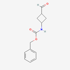 molecular formula C13H15NO3 B15131000 Carbamic acid, N-(cis-3-formylcyclobutyl)-, phenylmethyl ester 