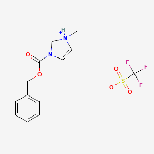 molecular formula C13H15F3N2O5S B15133711 benzyl 1-methyl-1,2-dihydroimidazol-1-ium-3-carboxylate;trifluoromethanesulfonate 