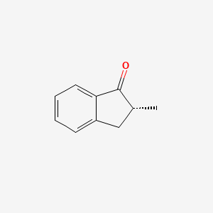 molecular formula C10H10O B15187570 2-Methylindanone, (R)- CAS No. 57128-12-8