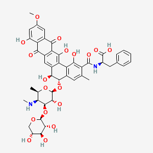 molecular formula C46H48N2O18 B15192027 D-Phenylalanine, N-((5-((4,6-dideoxy-4-(methylamino)-3-O-beta-D-xylopyranosyl-beta-D-galactopyranosyl)oxy)-5,6,8,13-tetrahydro-1,6,9,14-tetrahydroxy-11-methoxy-3-methyl-8,13-dioxobenzo(a)naphthacen-2-yl)carbonyl)-, (5S-trans)- CAS No. 148676-99-7