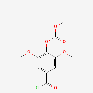 molecular formula C12H13ClO6 B15201813 4-(Chlorocarbonyl)-2,6-dimethoxyphenyl ethyl carbonate CAS No. 18780-68-2