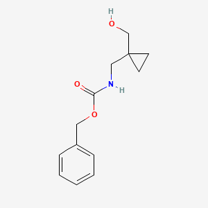 molecular formula C13H17NO3 B1520814 苄基 N-{[1-(羟甲基)环丙基]甲基}氨基甲酸酯 CAS No. 1323557-45-4