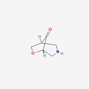 molecular formula C6H9NO2 B15220555 (1S,5S)-6-Oxa-3-azabicyclo[3.2.1]octan-8-one 