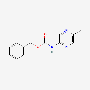 molecular formula C13H13N3O2 B1522721 Benzyl (5-methylpyrazin-2-yl)carbamate CAS No. 1033418-57-3