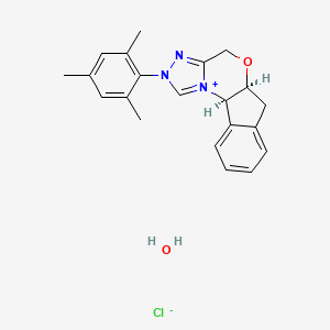 (5aS,10bR)-2-mesityl-4,5a,6,10b-tetrahydroindeno[2,1-b][1,2,4]triazolo[4,3-d][1,4]oxazin-2-ium chloride hydrate