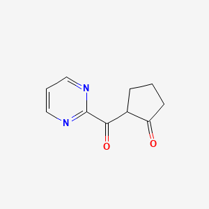 2-(Pyrimidine-2-carbonyl)cyclopentan-1-one