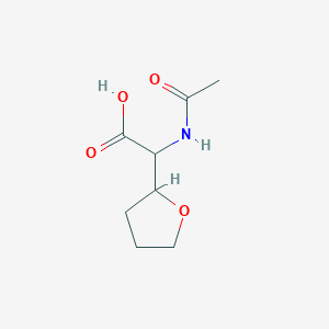 2-Acetamido-2-(oxolan-2-yl)acetic acid