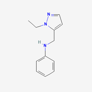 molecular formula C12H15N3 B15273954 N-[(1-Ethyl-1H-pyrazol-5-yl)methyl]aniline 