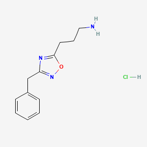 molecular formula C12H16ClN3O B1528120 3-(3-Benzyl-1,2,4-oxadiazol-5-yl)propan-1-amine hydrochloride CAS No. 1374408-39-5