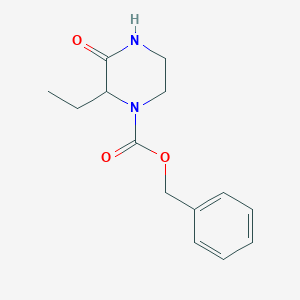 molecular formula C14H18N2O3 B15303881 2-Ethyl-3-oxo-piperazine-1-carboxylic acid benzyl ester 