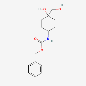 molecular formula C15H21NO4 B15305605 trans-4-(Cbz-amino)-1-(hydroxymethyl)cyclohexanol 