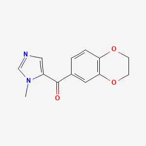 molecular formula C13H12N2O3 B1530737 5-(2,3-dihydro-1,4-benzodioxine-6-carbonyl)-1-methyl-1H-imidazole CAS No. 1557653-00-5