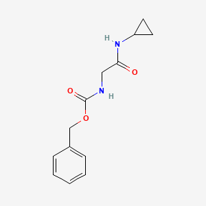 molecular formula C13H16N2O3 B1531072 Benzyl N-[(cyclopropylcarbamoyl)methyl]carbamate CAS No. 120436-01-3