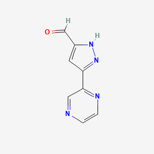 molecular formula C8H6N4O B1531339 3-(pyrazin-2-yl)-1H-pyrazole-5-carbaldehyde CAS No. 1347231-55-3
