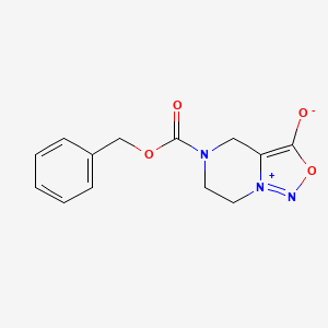 molecular formula C13H13N3O4 B1531936 5-[(Benzyloxy)carbonyl]-4,5,6,7-tetrahydro[1,2,3]oxadiazolo[3,4-a]pyrazin-8-ium-3-olate CAS No. 1161076-89-6