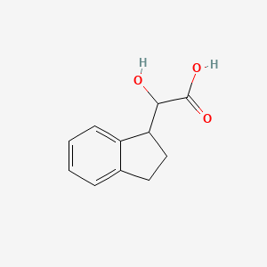 molecular formula C11H12O3 B15323195 2-(2,3-dihydro-1H-inden-1-yl)-2-hydroxyacetic acid 