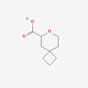 molecular formula C9H14O3 B15323325 7-Oxaspiro[3.5]nonane-6-carboxylicacid 