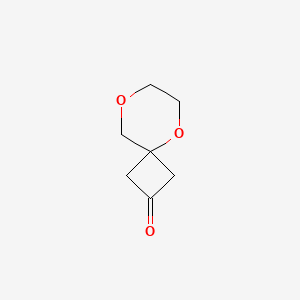 molecular formula C7H10O3 B15323796 5,8-Dioxaspiro[3.5]nonan-2-one 